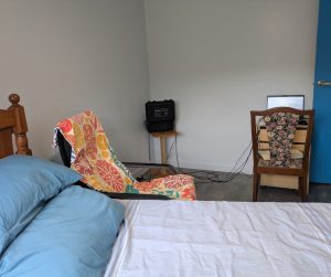 scalar machine in the background of bed and chair in the therapy room